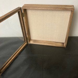 Wood framed shadow box.